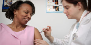 nurse giving vaccine