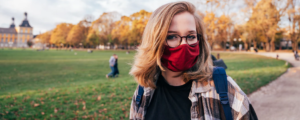 college student wearing mask outside