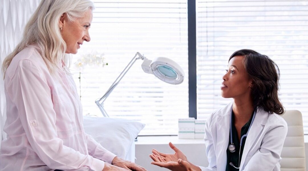 female doctor talking to female patient