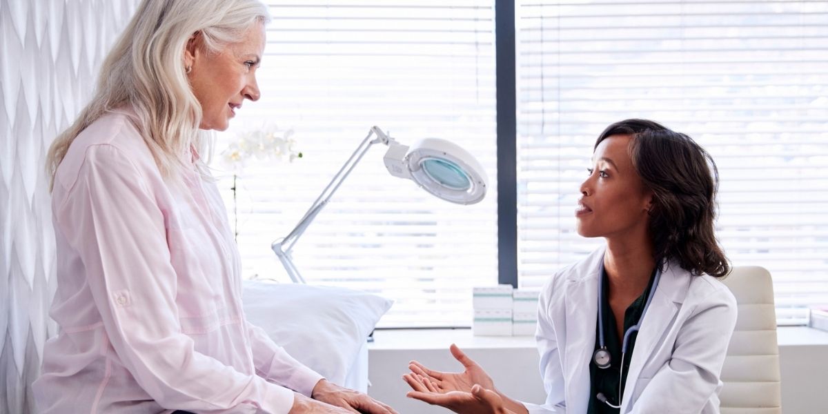 female doctor talking to female patient