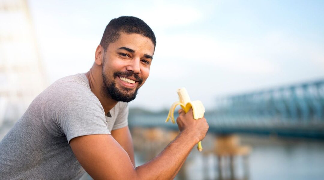 man eating a banana