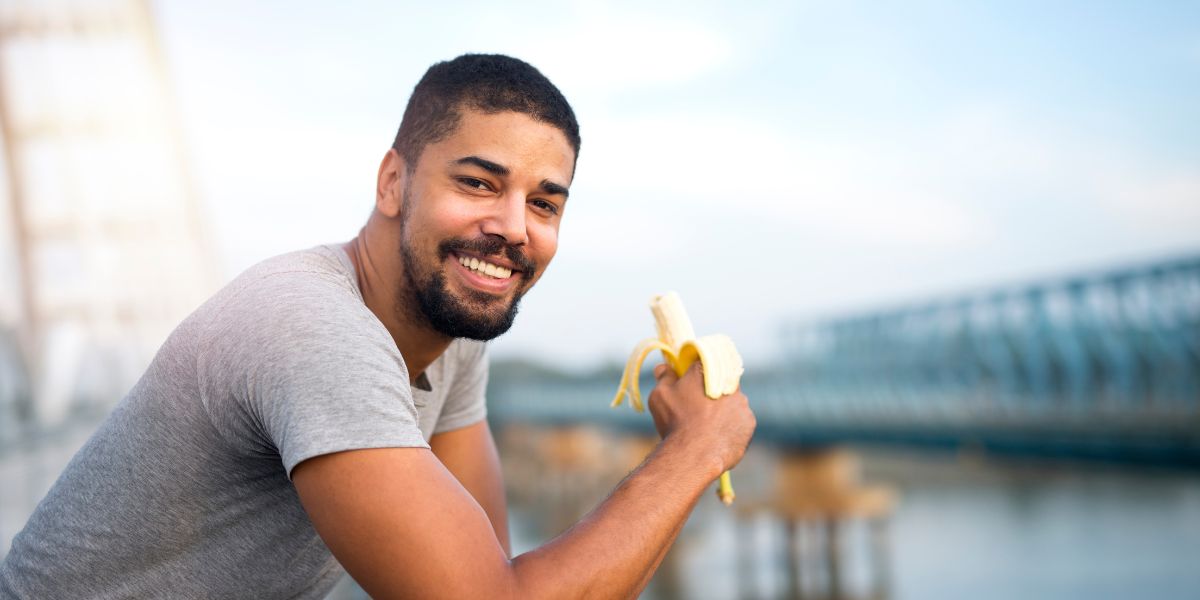 man eating a banana