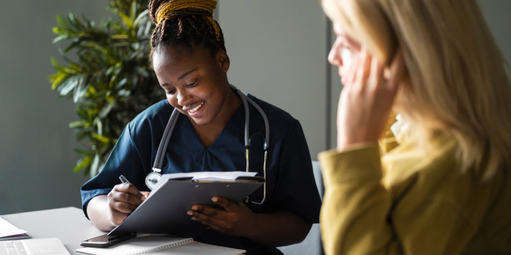 african american nurse taking notes on employee mental health