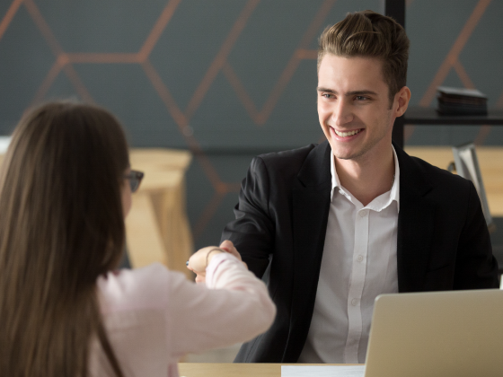 male human resources worker meeting with female employee returning to work