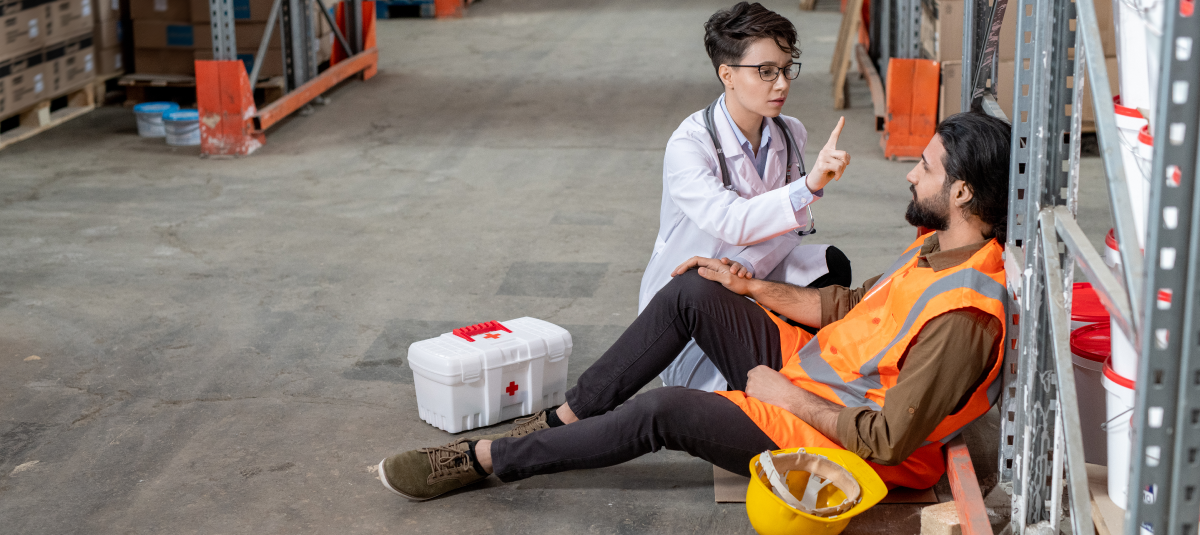 on-site nurse performing exam on injured warehouse employee